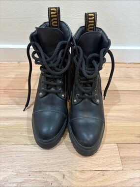 Miu Miu Black Lace-Up Leather Combat Boots with Yellow Logo Pull Tabs